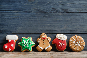 Tasty homemade Christmas cookies on table, space for text