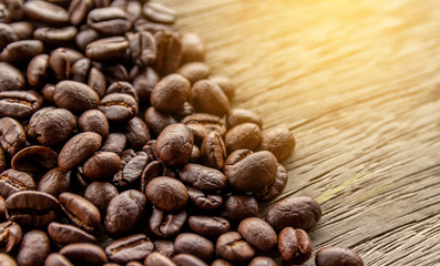 Coffee beans on old wood background 