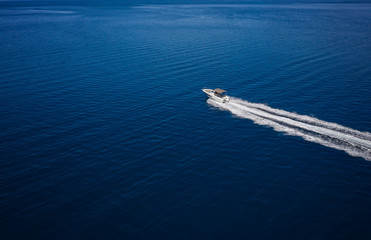 Aerial view of speed motor boat on open sea