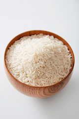 Fototapeta na wymiar Basmati white rice in a bowl isolated on a white background. Natural organic raw 