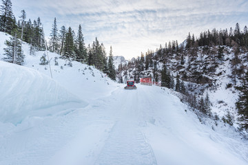 Fototapeta na wymiar Winter landscape in the Austrian alps, snowy road, and snowdrifts