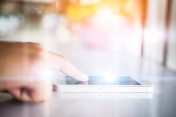 Close up of woman's hand using smartphone.