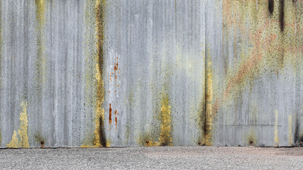 abandoned and weathered corrugated zinc sheet wall.