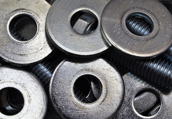 Group of Industrial steel washers and bolts, zinc heap chrome. Industrial background.