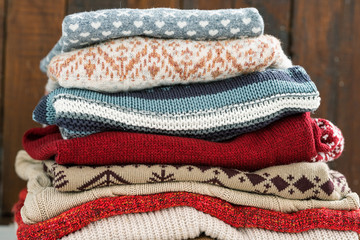 Warm cotton and woolen sweaters on top of each other prepared for cold season