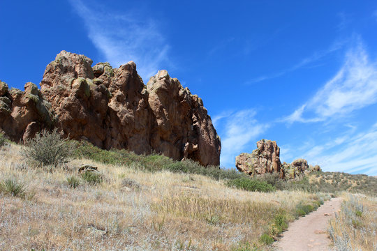 The Devil's Backbone rock formation with bright sunshine and hiking trail in Colorado, USA