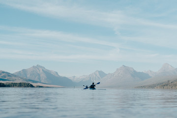 Naklejka premium Kayaking on lake McDonald in Glacier National Park