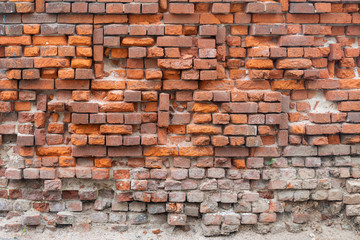 Crumbling Red Brick Wall