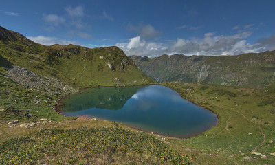 Fototapeta na wymiar Caucasus. Mountain lake on a sunny day