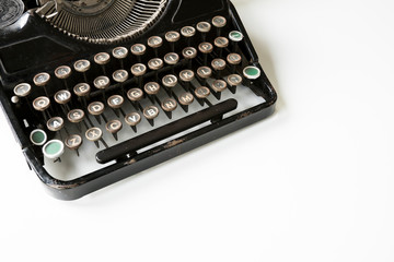 vintage typewriter on white desk. Copy space