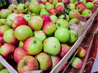Assortment of fresh apple fruits at market.