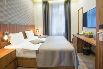 Fototapeta na wymiar Hotel bedroom interior in the morning