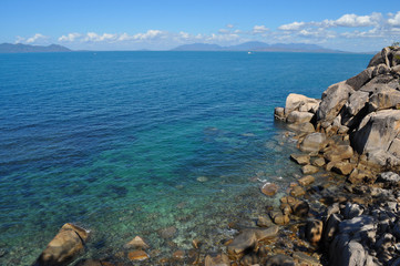 Rocky coast from The Gabul Way, a raised floating walkway linking Nelly Bay and Geoffrey Bay on Magnetic Island, looking towards the mainland, Queensland, Australia