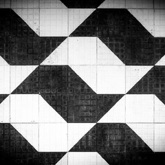 Close up detail of Sao Paulo street sidewalk. Made of cement in black and white colors these tiles or bricks are symbol of the city. Graphics, background, travel, tourism and architecture concept.
