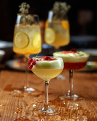 Glass of Aperol Spritz cocktail on the table in restaurant, famous refreshing drink