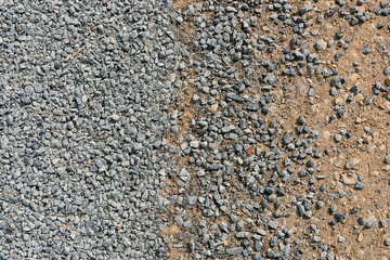 Joint of pavings. Background from a pile of small stones of gray rubble. grey gravel floor texture background