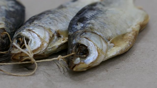 Dried Salt Fish Kraft Paper Background Panning Slider Shot.