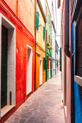 Fototapeta na wymiar Narrow street on Burano island, Venice, Italy