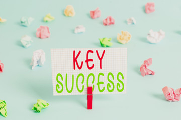 Conceptual hand writing showing Key Success. Concept meaning generally three to five areas that company may focus on Colored clothespin rectangle shaped paper blue background