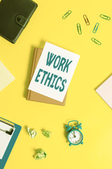 Text sign showing Work Ethics. Business photo showcasing A set of values centered on the importance of doing work Pile of empty papers with copy space on the table