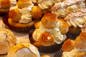 Freshly baked stuffed sweet pastries Orange Lactee and Dome Citron with fruits in traditinal French...