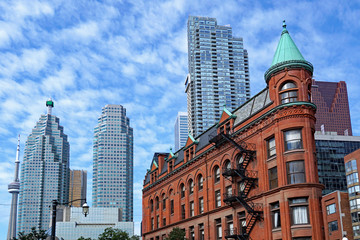 Fototapeta na wymiar Toronto, financial district skyline in the background with Victorian flatiron building in the foreground