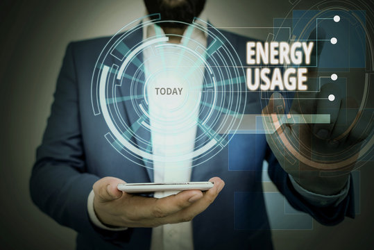 Conceptual hand writing showing Energy Usage. Concept meaning Amount of energy consumed or used in a process or system Male wear formal suit presenting presentation smart device