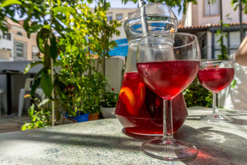 Homemade sangria in pitcher and glasses.
