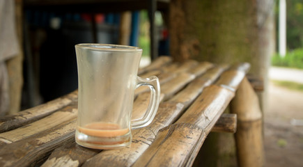 cup of tea on wooden table in local cafe in Bangladesh
