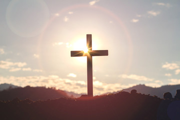 Christian, Christianity, Religion copy space background.cross on blurry sunset background.