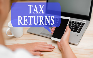 Word writing text Tax Returns. Business photo showcasing Tax payer financial information Tax Liability and Payment report woman laptop computer smartphone mug office supplies technological devices