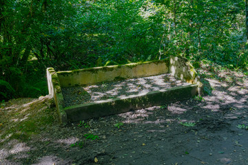 Old disused steam railway coal bunker on footpath