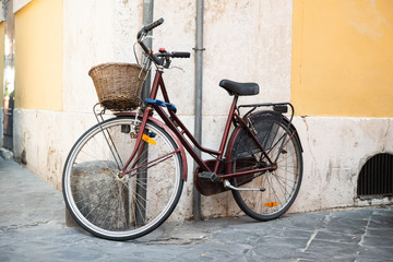 Fototapeta na wymiar Classic Bicycle On Old Italian Street