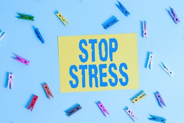 Handwriting text Stop Stress. Conceptual photo Seek help Take medicines Spend time with loveones Get more sleep Colored clothespin rectangle shaped reminder paper light blue background