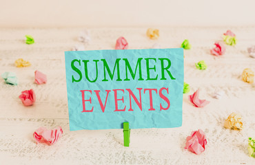 Word writing text Summer Events. Business photo showcasing Celebration Events that takes place during summertime Green clothespin white wood background colored paper reminder office supply