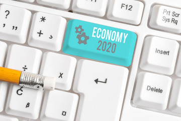 Writing note showing Economy 2020. Business concept for State of wealth and resources of a country...