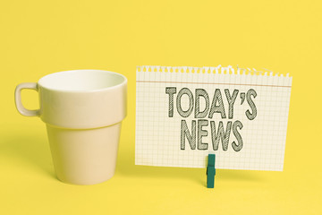 Writing note showing Today S News. Business concept for Latest Breaking Headlines Current Updates Trending Cup empty paper blue clothespin rectangle shaped reminder yellow office