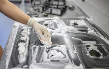 cleaning with a foam gas stove with a glass surface.