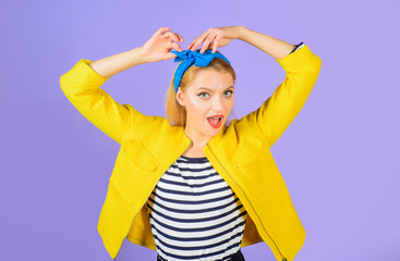 Pin-up girl. Smiling woman dressed in pin-up style. Expressive facial expressions. Smiling retro girl. Emotional girl. Smiling woman with clean skin, bright make-up. Retro fashion and vintage concept.