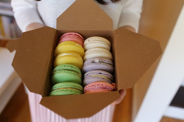 colorful macaroons with wedding band inside for proposal