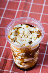 a cup of silken soy milk with muscuvado sugar and sago also known as taho