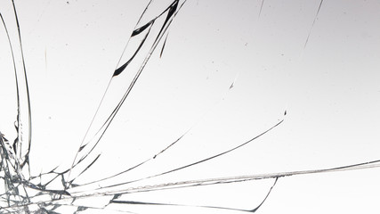 Fototapeta na wymiar Cracked glass on a white background texture