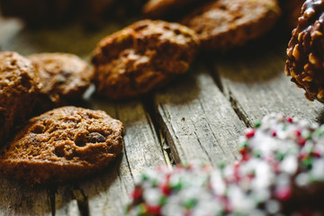 Chocolate chips and cookies with delicious topping, brown tones.