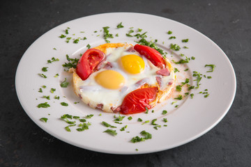 Healthy breakfast. Omelette from eggs, ham and vegetables.