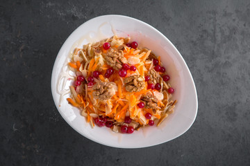 Healthy breakfast. Vitamin salad from apple, carrot, nuts, almonds and berries. Dietary, nutritious, healthy snacks