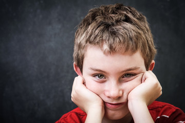 Bored student resting his head on his hands
