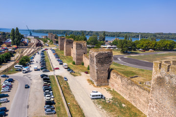 Fototapeta na wymiar Aerial view of Smederevo (Szendro) Byzantine and Ottoman castle and walled town along the Danube river in Serbia former Yugoslavia with moat and partially restored towers