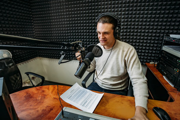 Talking male radio presenter in radio station