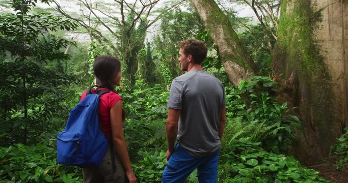 Hiking people in rainforest on Oahu, Hawaii, USA