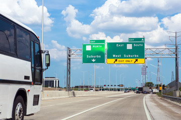 Traffic and highway signs on the highway on a summer day